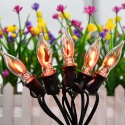 Couah Christmas Flickering String Lights, 10FT Flickering Amber Flame C7 Christmas String Lights Outdoor Decoration Lights For Christmas Tree - Black Wire -Xmas Lighting Shop 719Z3zfrLNL. AC SL1500
