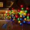Windpnn 4-Pack Solar Snowflake Christmas Pathway Lights Multi-Color, Waterproof Christmas Garden Stake Lights Outdoor Solar Christmas Decorations Lights For Garden Yard Patio Lawn Pathway