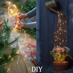 ANGMLN Solar Waterfall Fairy Bunch Lights Outdoor Waterproof,200 LEDs 8 Modes Watering Can Light (No Watering Can), Solar Powered Firefly Moon Plants Christmas Tree Vines Decorations -Xmas Lighting Shop 71qdRy8JiUL. AC SL1000