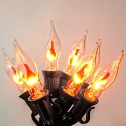 Couah Christmas Flickering String Lights, 10FT Flickering Amber Flame C7 Christmas String Lights Outdoor Decoration Lights For Christmas Tree - Black Wire -Xmas Lighting Shop 71zvSIr9YIL. AC SL1500